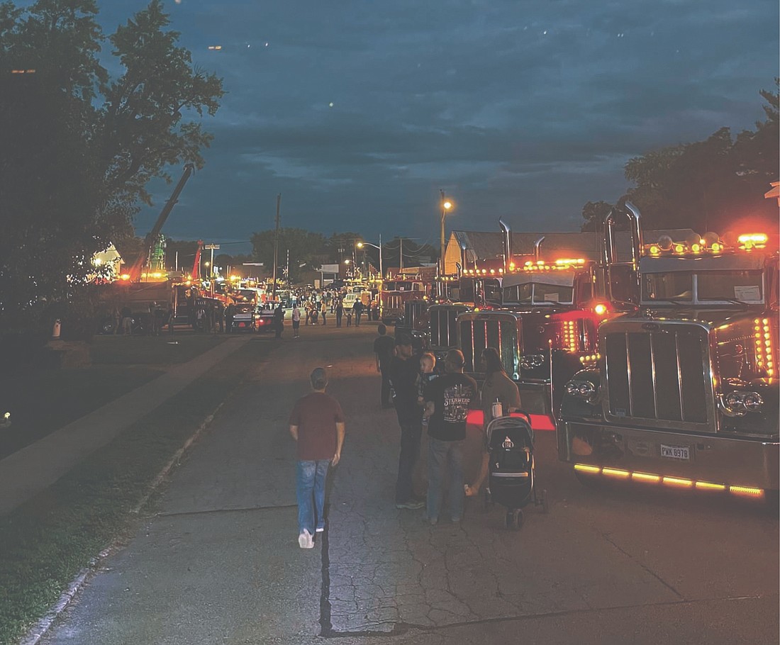 College Corner lit up well into the night on Friday at the semi and tractor show.