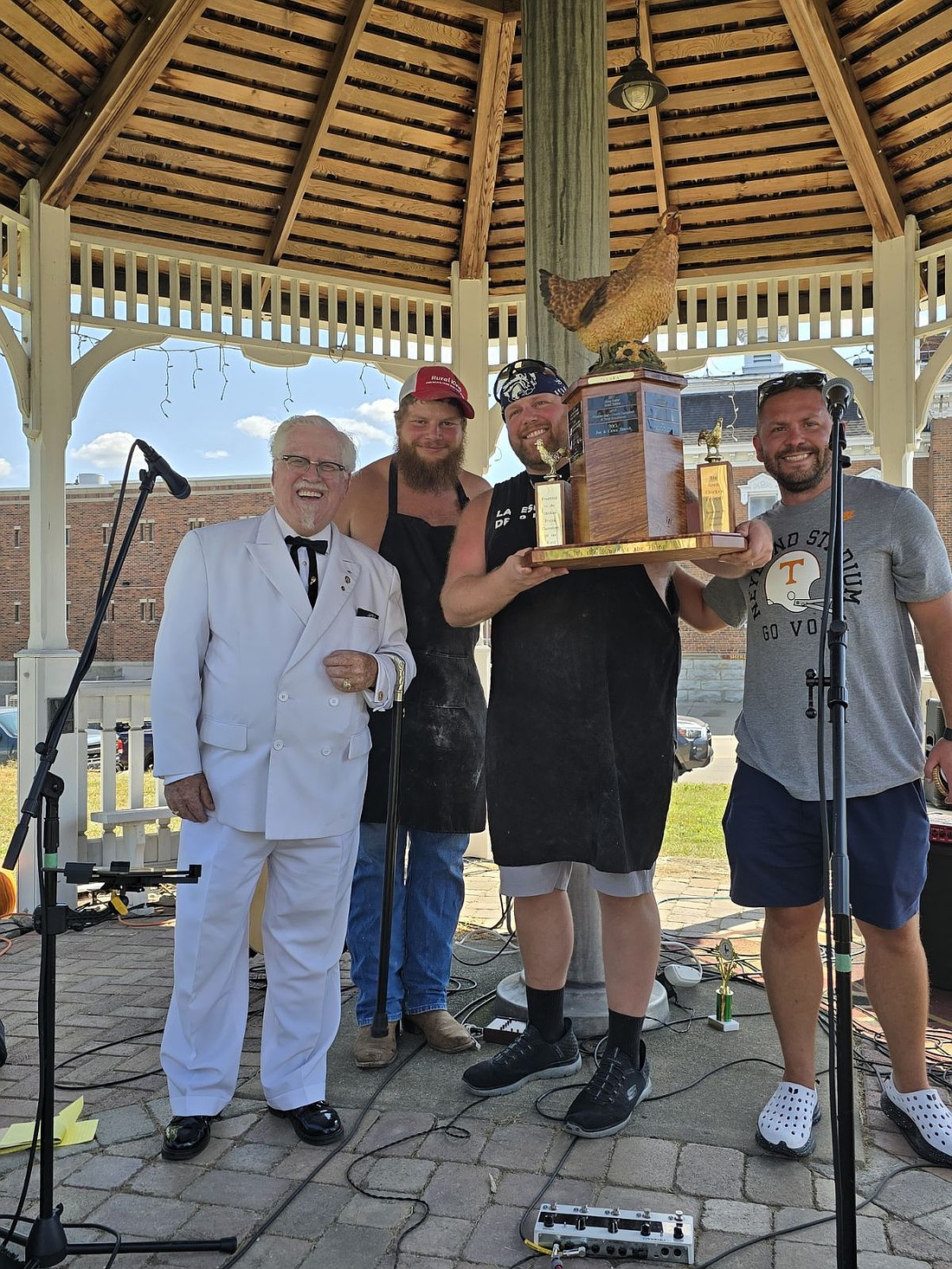 Team “Praise the Lard” is the winner of the chicken fry-off. Pictured left to right are Colonel Sanders (Johnny D. Miller,) Logan Meier, Joey Singer and Ryan Patterson.