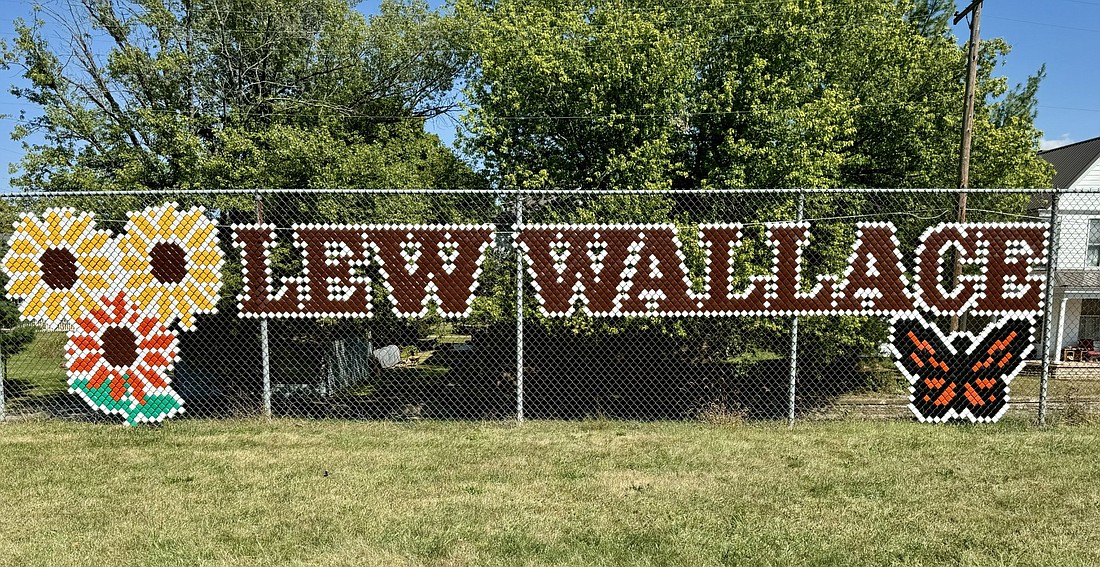 The new fence mural at the Lew Wallace Community Garden is expected to be completed this week.