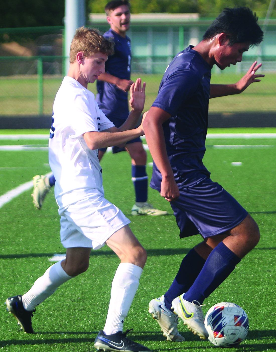 OA’s Mason Thomson defends FC’s Brian Chen.