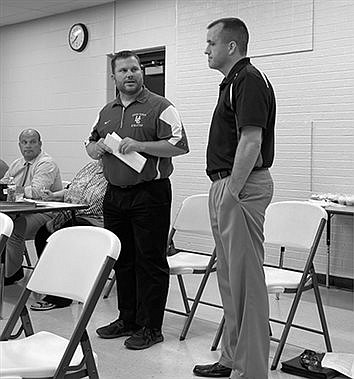 School board meets new basketball coach