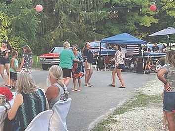 Community members dancing in the street